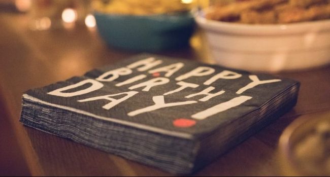 Black Happy Birthday napkins on a table at a Kyiv party